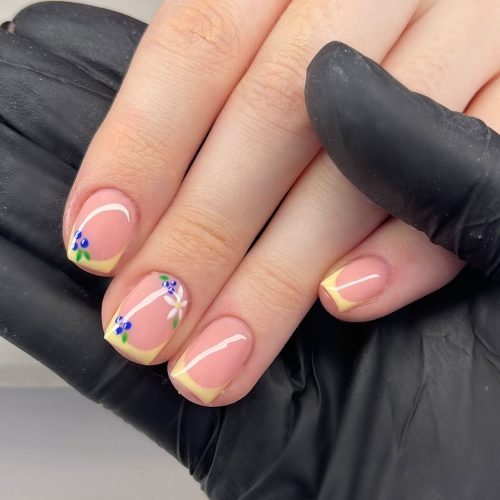 21-Yellow French Tips with Tiny Blueberries and Floral Accents